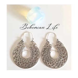 Silver hoop earrings with circular and spiral filigree below the words "Bohemian Life"
